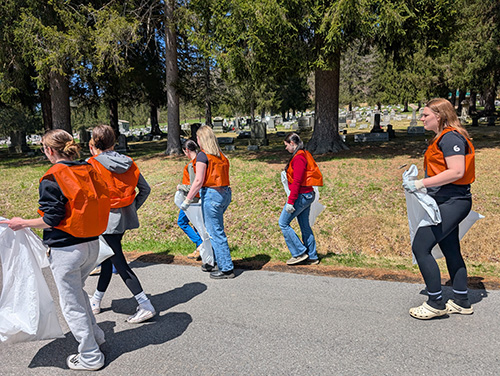 Students walking the neighborhood streets on Earth Day