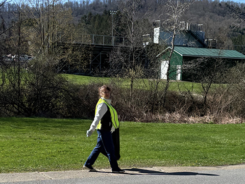 Seneca CTC representative walking down a neighborhood street