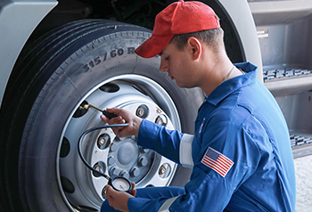 Student working on a tire