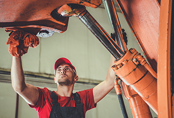 Technician student working on a machine